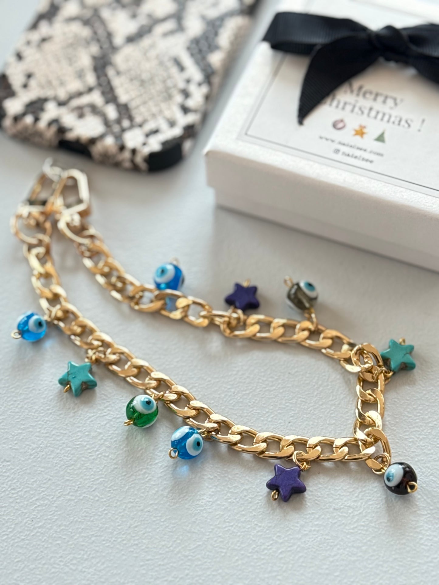 Gold plated shades of blue evil eye wristlet