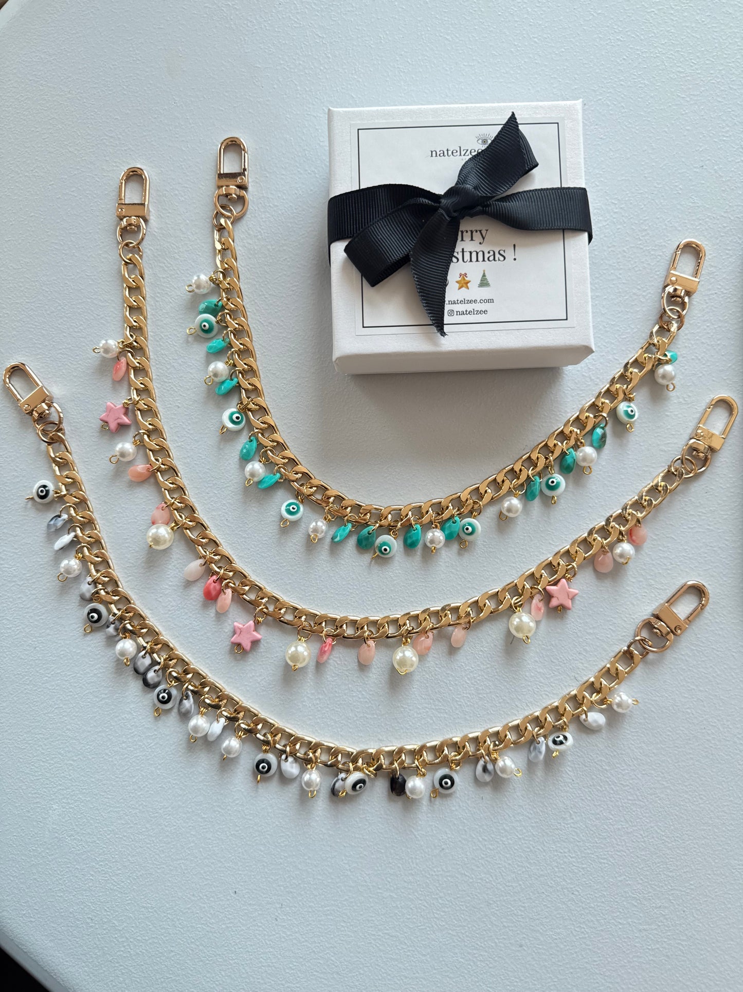 Black and Gold evil eye bauble wristlet