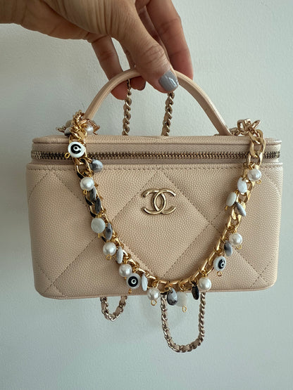 Black and Gold evil eye bauble wristlet