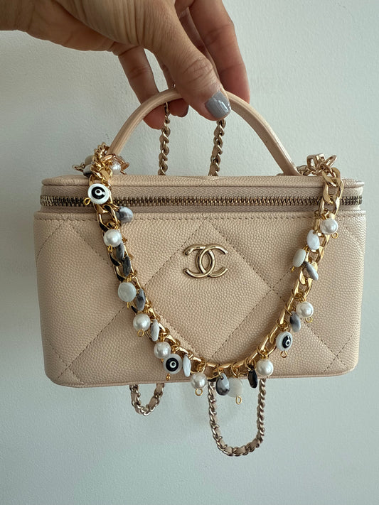 Black and Gold evil eye bauble wristlet