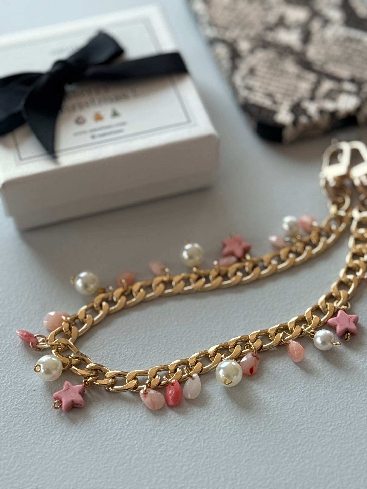 Gold and pink pearl and star bauble wristlet
